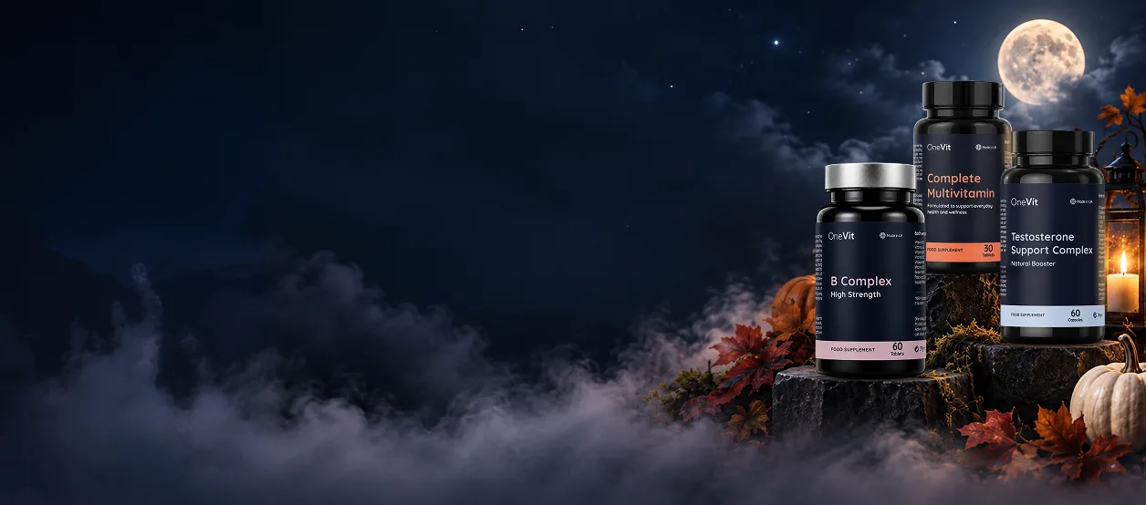 OneVit B Complex, Complete Multivitamin and Testosterone Support Complex on mossy stone steps under a full moon, with pumpkins and a candle lantern